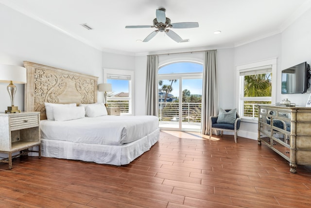 bedroom with access to exterior, visible vents, crown molding, and wood finished floors