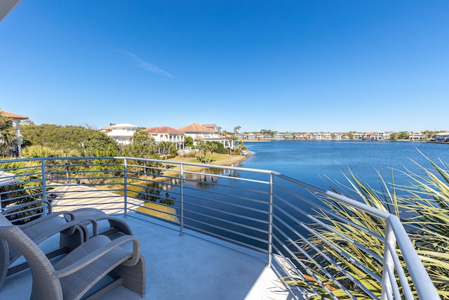 balcony featuring a water view