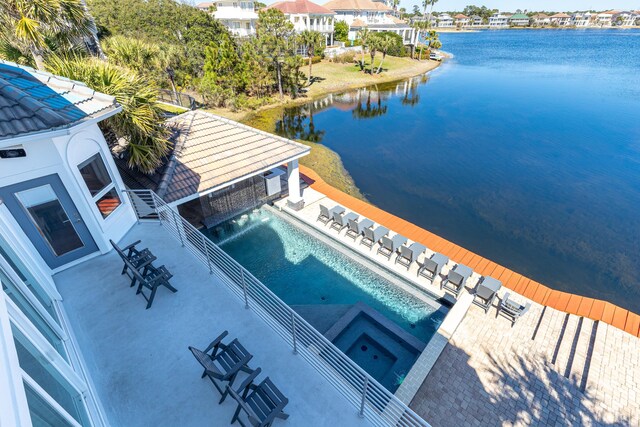 birds eye view of property with a water view