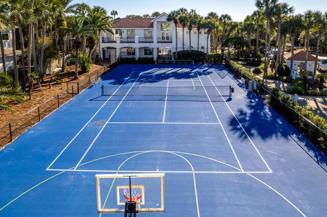 view of sport court featuring fence