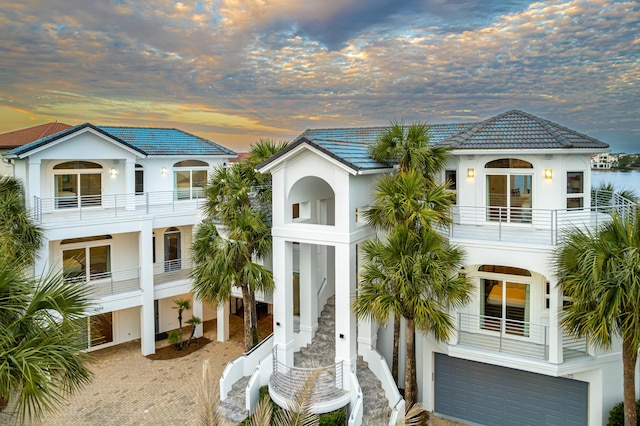 4659 Destiny Way, Destin, FL 32541 - view of front of property with stucco siding, an attached garage, driveway, and a tiled roof