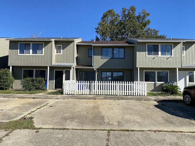 view of property with fence