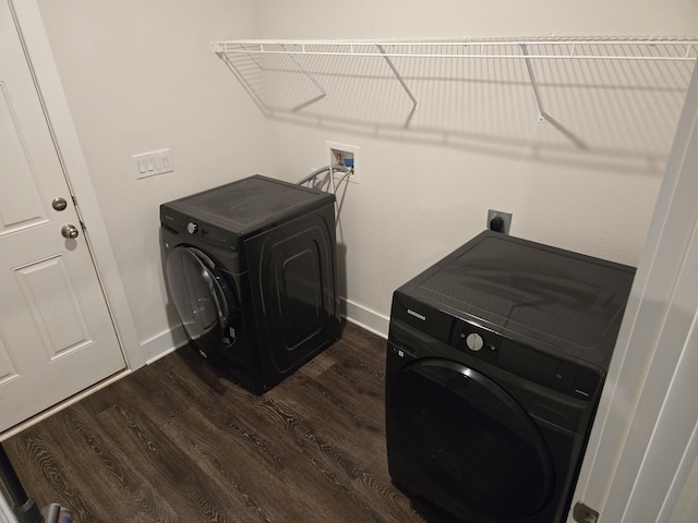 washroom with laundry area, baseboards, washer / clothes dryer, and dark wood-style flooring