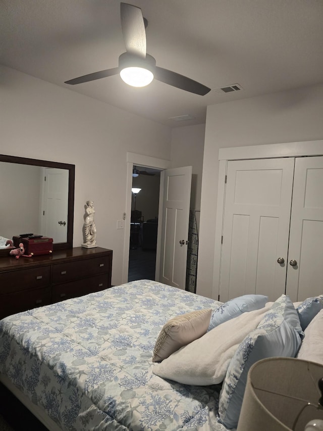 bedroom with a ceiling fan, a closet, and visible vents