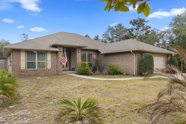 view of front of house with a garage, brick siding, and a shingled roof