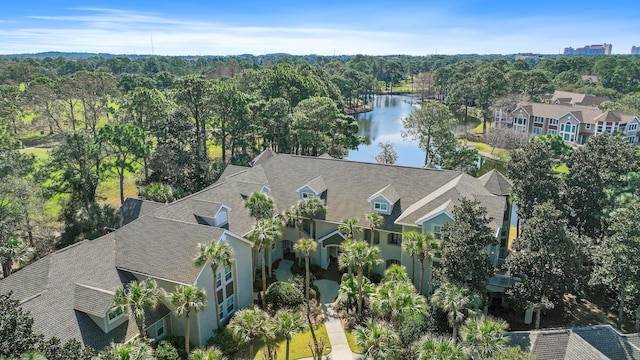 drone / aerial view with a water view and a residential view