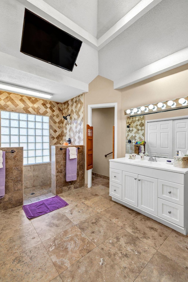 full bathroom with walk in shower and vanity