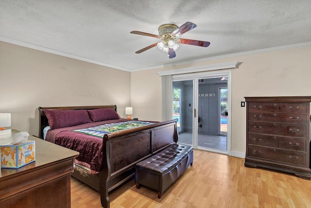 bedroom with access to exterior, crown molding, light wood-style flooring, and a textured ceiling