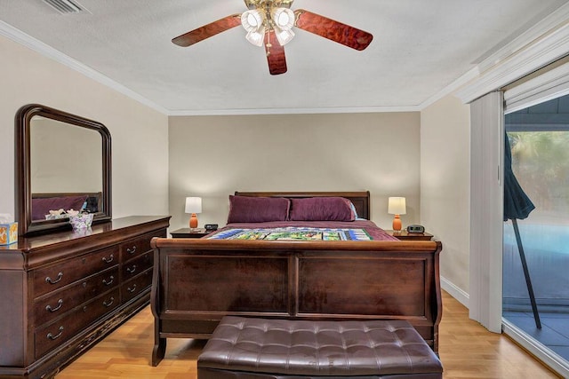 bedroom with light wood-type flooring, crown molding, baseboards, and ceiling fan