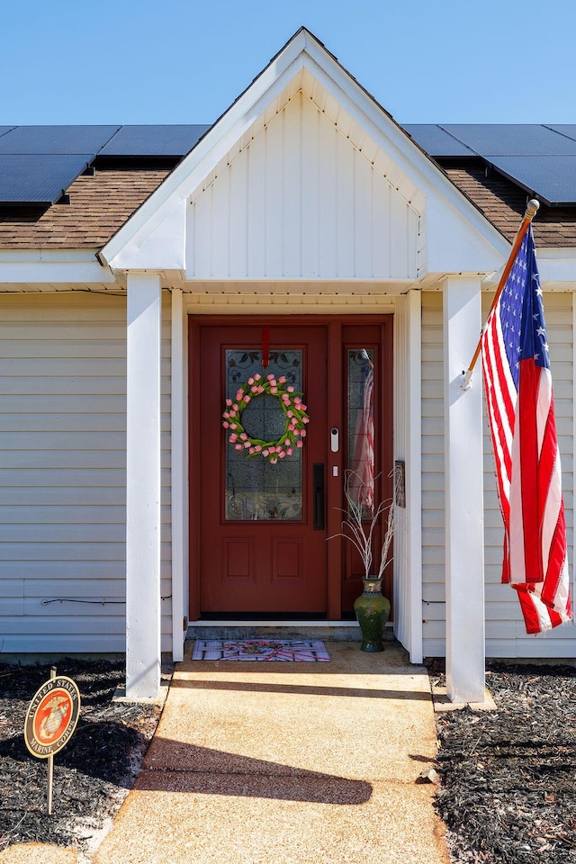 doorway to property with solar panels