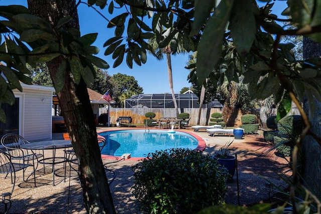 view of swimming pool featuring a fenced in pool, a fenced backyard, and a patio