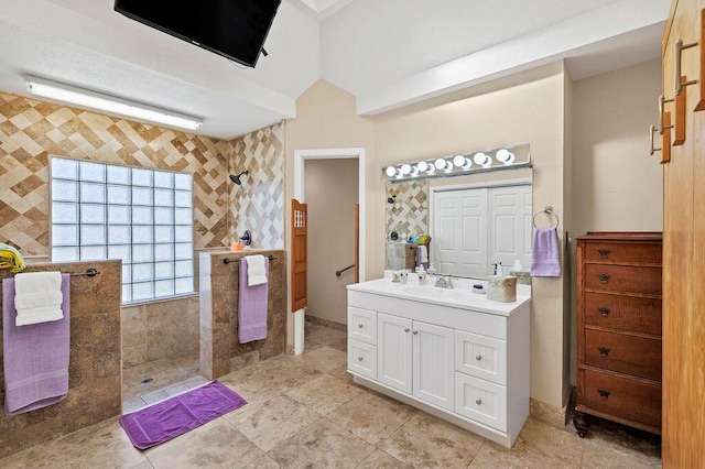 bathroom with vanity and a walk in shower