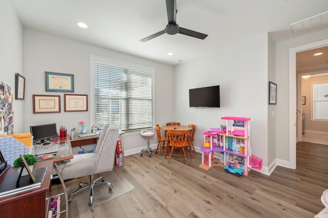 home office with recessed lighting, visible vents, baseboards, and wood finished floors