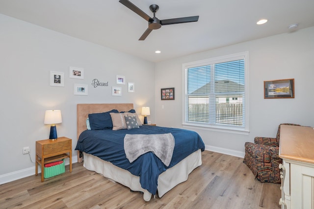 bedroom with recessed lighting, ceiling fan, light wood-style flooring, and baseboards