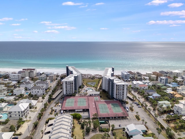 birds eye view of property with a beach view and a water view