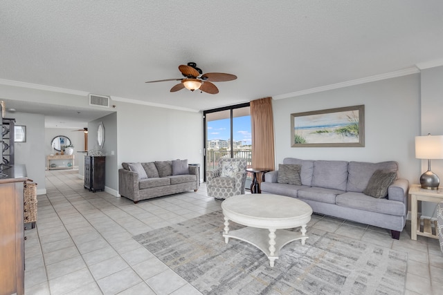 living area featuring ornamental molding, visible vents, a textured ceiling, and light tile patterned floors