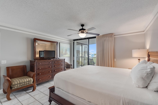 bedroom featuring access to exterior, crown molding, light tile patterned floors, expansive windows, and a textured ceiling