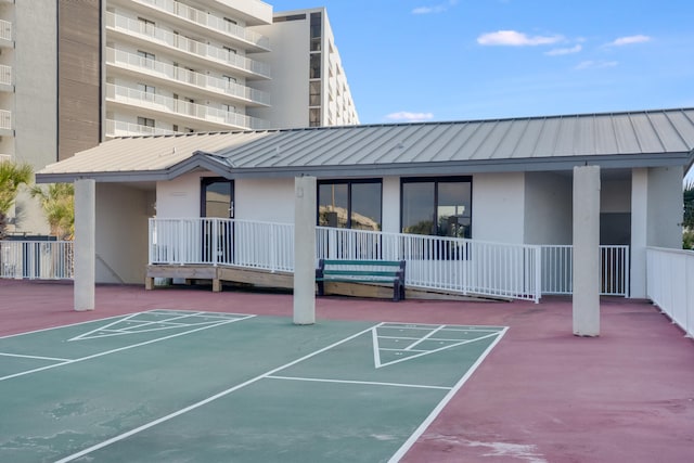 view of home's community featuring shuffleboard