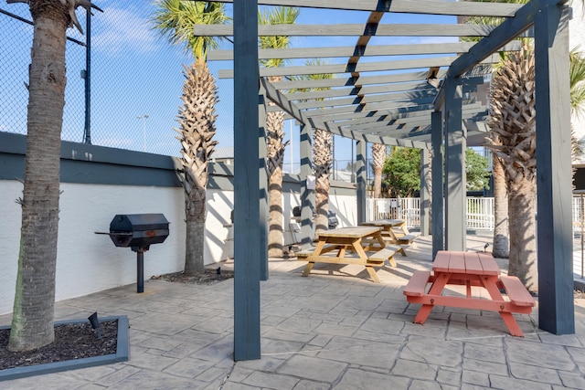 view of patio / terrace featuring fence, outdoor dining area, and a pergola