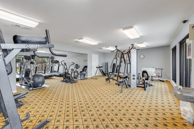 gym featuring visible vents and baseboards