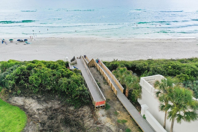 bird's eye view featuring a water view and a view of the beach