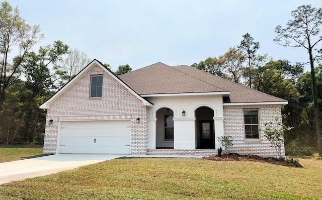2720 Louis Cir, Crestview, FL 32536 - ranch-style home featuring brick siding, driveway, a front yard, and roof with shingles