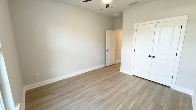 2720 Louis Cir, Crestview, FL 32536 - unfurnished bedroom featuring a closet, baseboards, light wood finished floors, ceiling fan, and visible vents