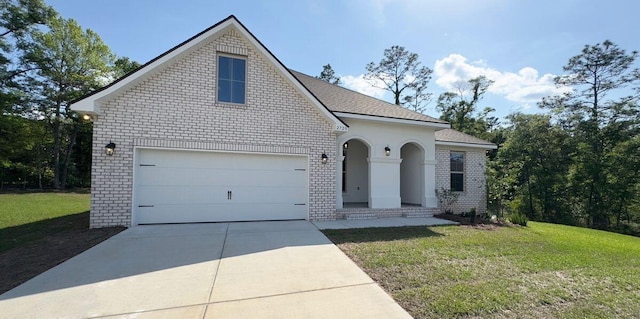2720 Louis Cir, Crestview, FL 32536 - traditional home featuring concrete driveway, brick siding, and a front yard