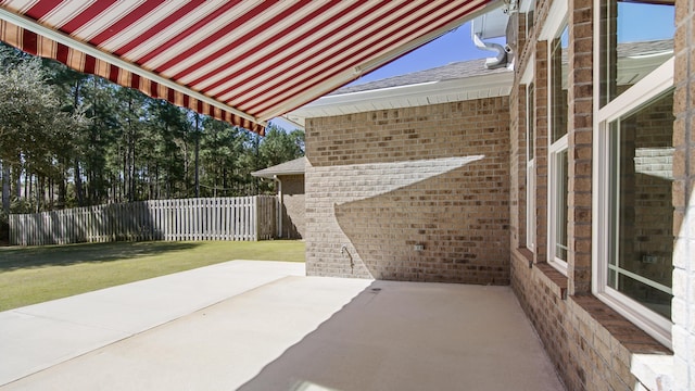 view of patio featuring fence
