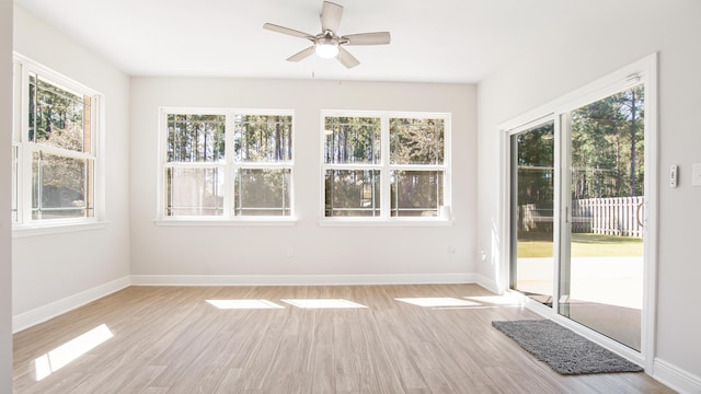 unfurnished sunroom featuring a wealth of natural light