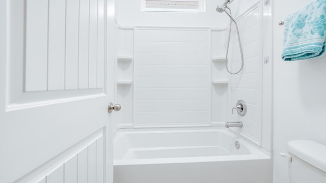 full bath featuring toilet and bathing tub / shower combination