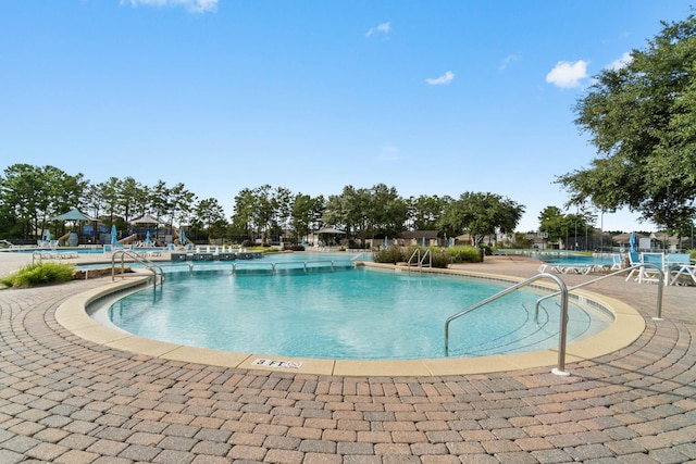 232 Brighton Cv, Freeport, FL 32439 - community pool with a patio