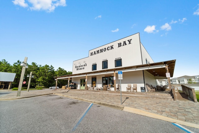 232 Brighton Cv, Freeport, FL 32439 - view of building exterior featuring uncovered parking