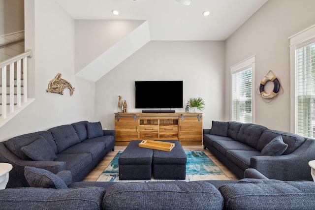 living area featuring stairway, recessed lighting, and wood finished floors