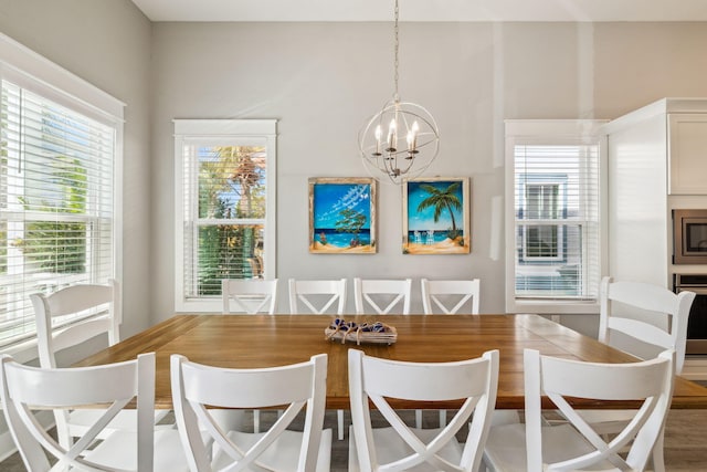 dining space featuring a chandelier