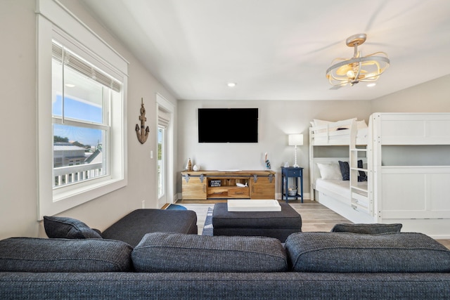 living room with recessed lighting and wood finished floors