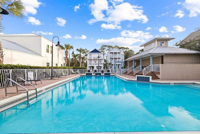 pool featuring a patio area and fence