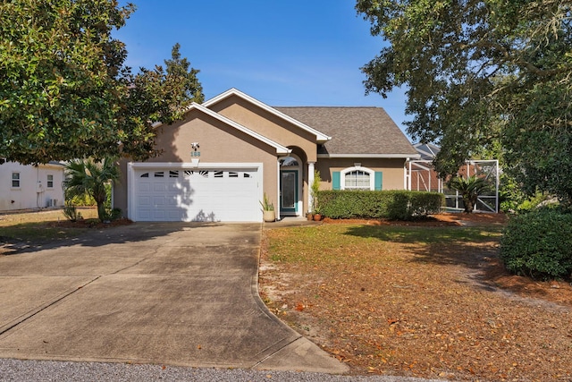 ranch-style house with a garage, driveway, and stucco siding