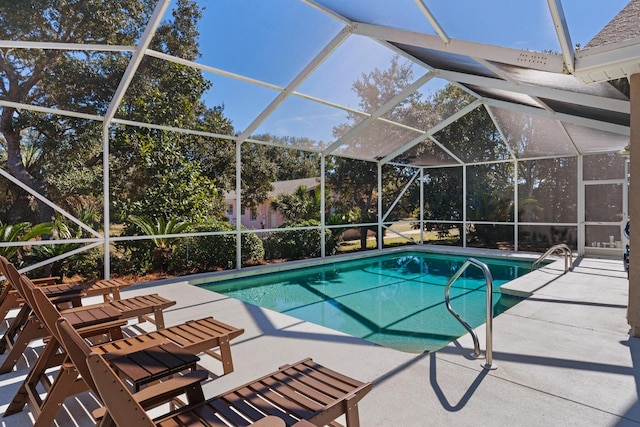 pool featuring a lanai and a patio area