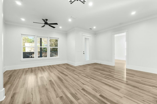 unfurnished room with crown molding, recessed lighting, baseboards, and light wood-style floors