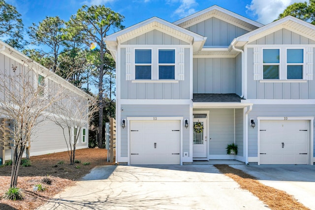 view of front facade featuring board and batten siding, concrete driveway, and an attached garage