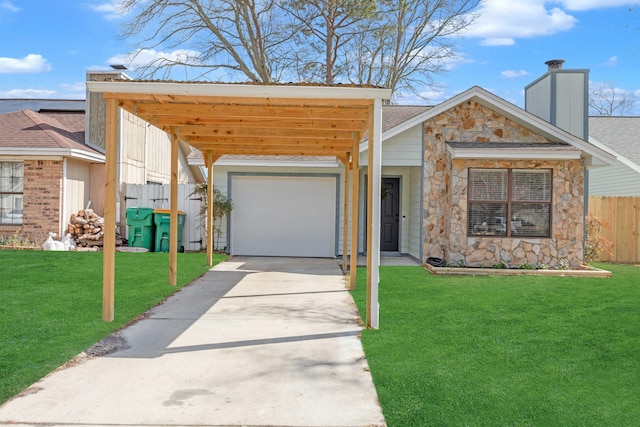 view of front of property featuring stone siding, driveway, a front lawn, and fence