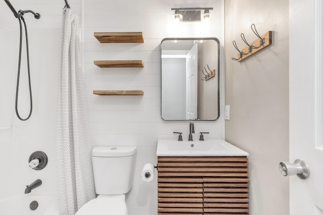 bathroom featuring shower / tub combo, vanity, and toilet