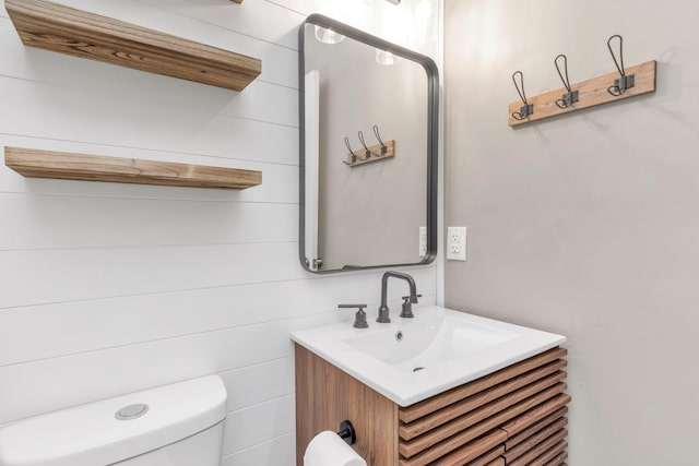 bathroom with toilet and vanity