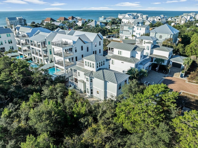 birds eye view of property with a water view and a residential view