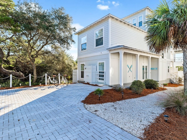 exterior space featuring decorative driveway