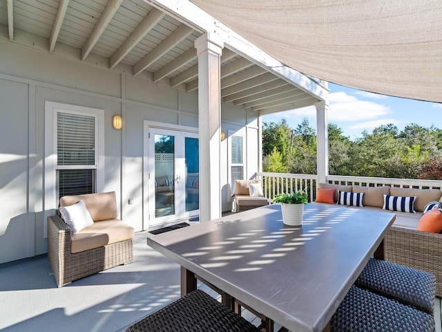 view of patio / terrace with outdoor dining area, french doors, and an outdoor hangout area