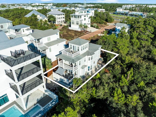 birds eye view of property with a residential view