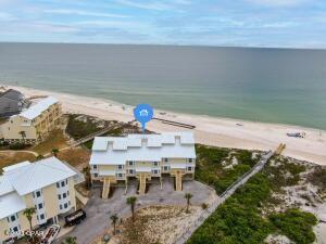 bird's eye view with a view of the beach and a water view