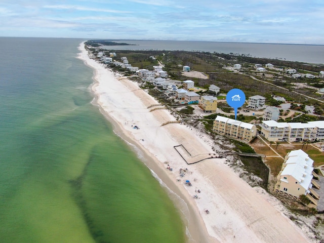 bird's eye view featuring a water view and a view of the beach